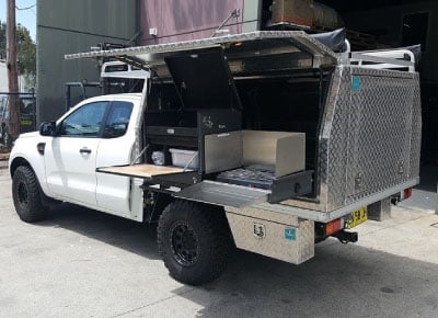 Top End Campgear Longhaul Camp Kitchen installed on the Low Mount Slide inside an aluminium ute canopy, creating an organised and accessible touring kitchen.