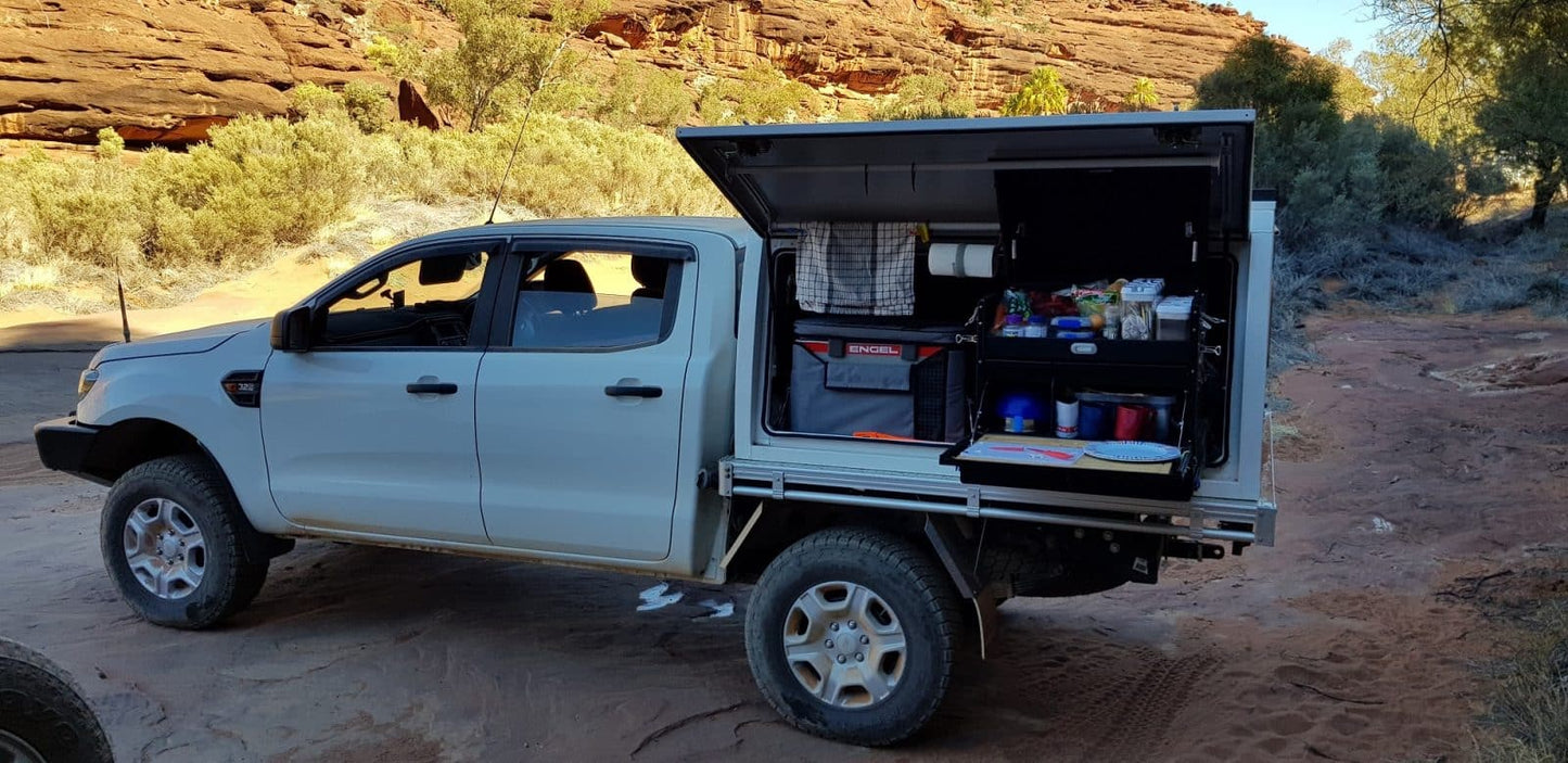 Top End Campgear Longhaul Camp Kitchen on the Low Mount Slide providing organised storage and easy access inside a touring ute canopy.