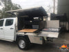 Longhaul Camp Kitchen with Low Mount Slide installed in a ute canopy for convenient slide-out cooking access.