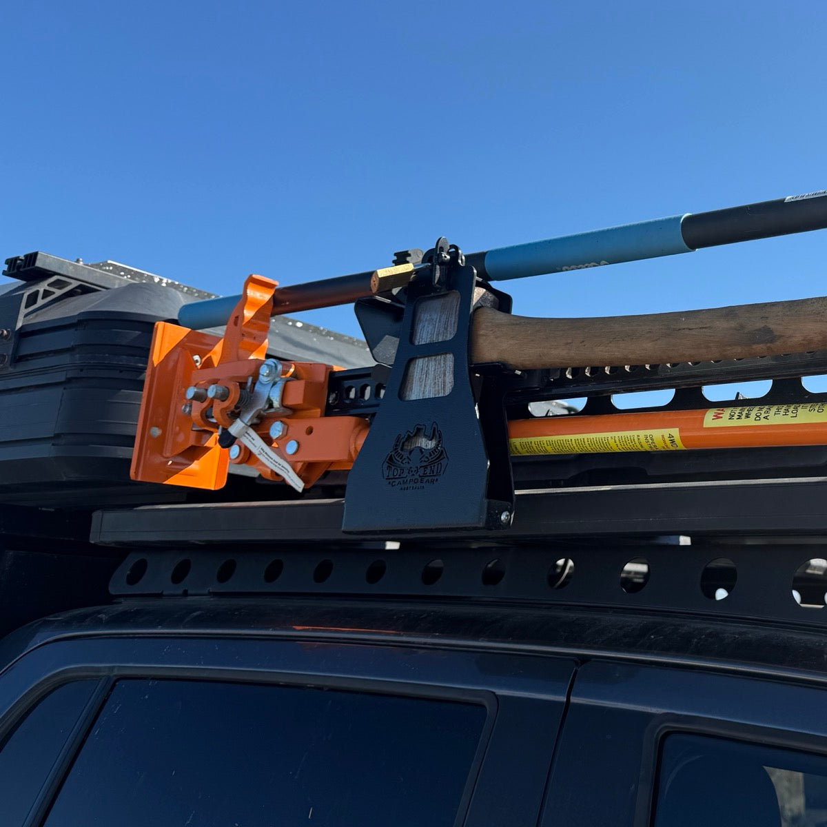 Top End Axe, Jack & Shovel Rack fitted to a 4WD roof rack, loaded with axe, high-lift jack and shovel